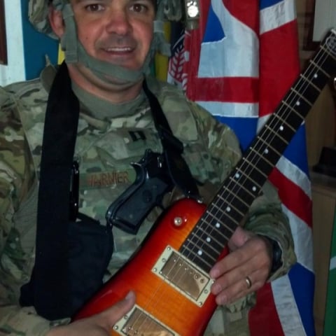Captian V with his Rambler Travel Guitar in Afghanistan