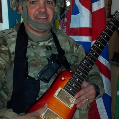 Captian V with his Rambler Travel Guitar in Afghanistan