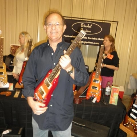 Jerry S. checking out a Rambler Travel Guitar at the Orlando Guitar Expo