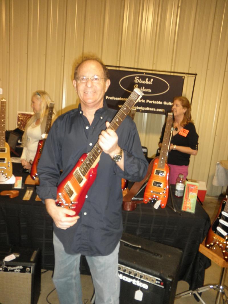 Jerry S. checking out a Rambler Travel Guitar at the Orlando Guitar Expo