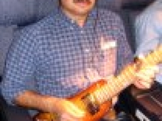 Jammin' in first class with a Rambler Travel Guitar