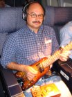 Jammin' in first class with a Rambler Travel Guitar