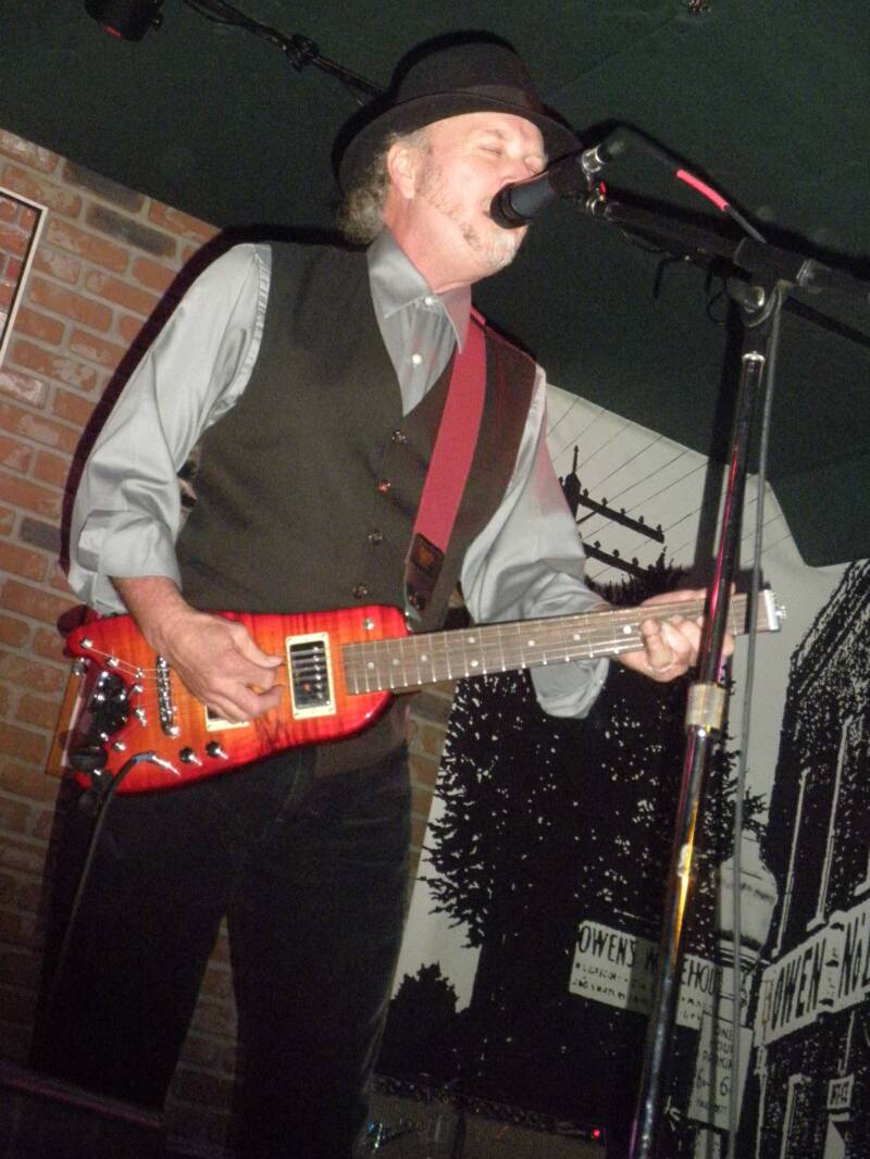 Roy Rogers playing his slice on his Rambler Travel Guitar