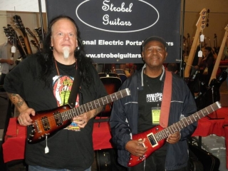 Smokin' Joe with Bnois with thier Rambler Travel Guitars