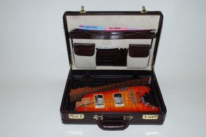 Rambler® travel guitar stowable in a briefcase