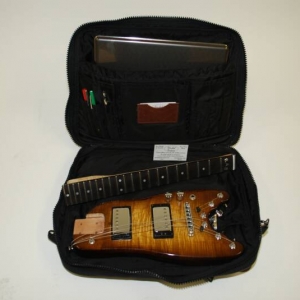 Rambler Electric Travel Guitar in a computer bag