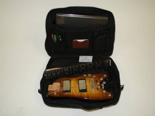 Rambler Electric Travel Guitar in a computer bag
