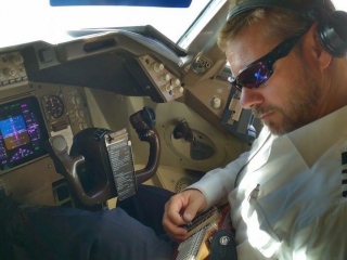 Capt. Buter jammin in the cockpit with his Rambler Portable Guitar