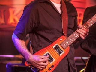JP Soars picking a Rambler Travel Guitar (photo courtesy of Jay Skolink)