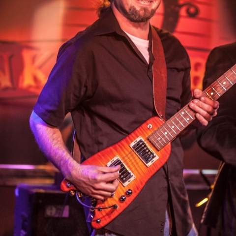 JP Soars picking a Rambler Travel Guitar (photo courtesy of Jay Skolink)