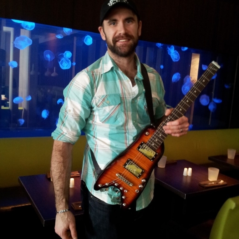 Jay Harrison of Winnepeg Jets trying out his new Rambler Travel Guitar