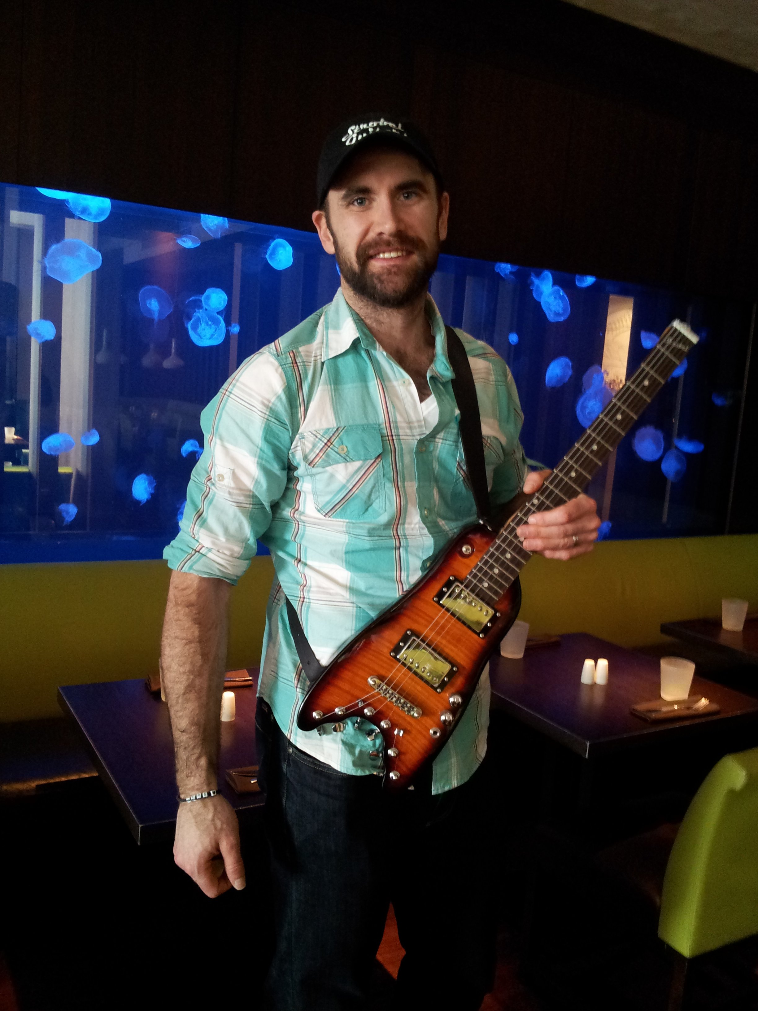 Jay Harrison of Winnepeg Jets trying out his new Rambler Travel Guitar