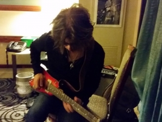 Johhny A checking out a Rambler Travel Guitar