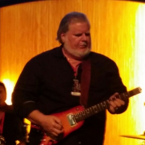 Rey pickin some licks on his Rambler Portable Guitar