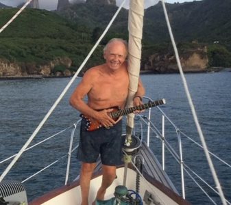 Rusty sailing with his Rambler Travel Guitar